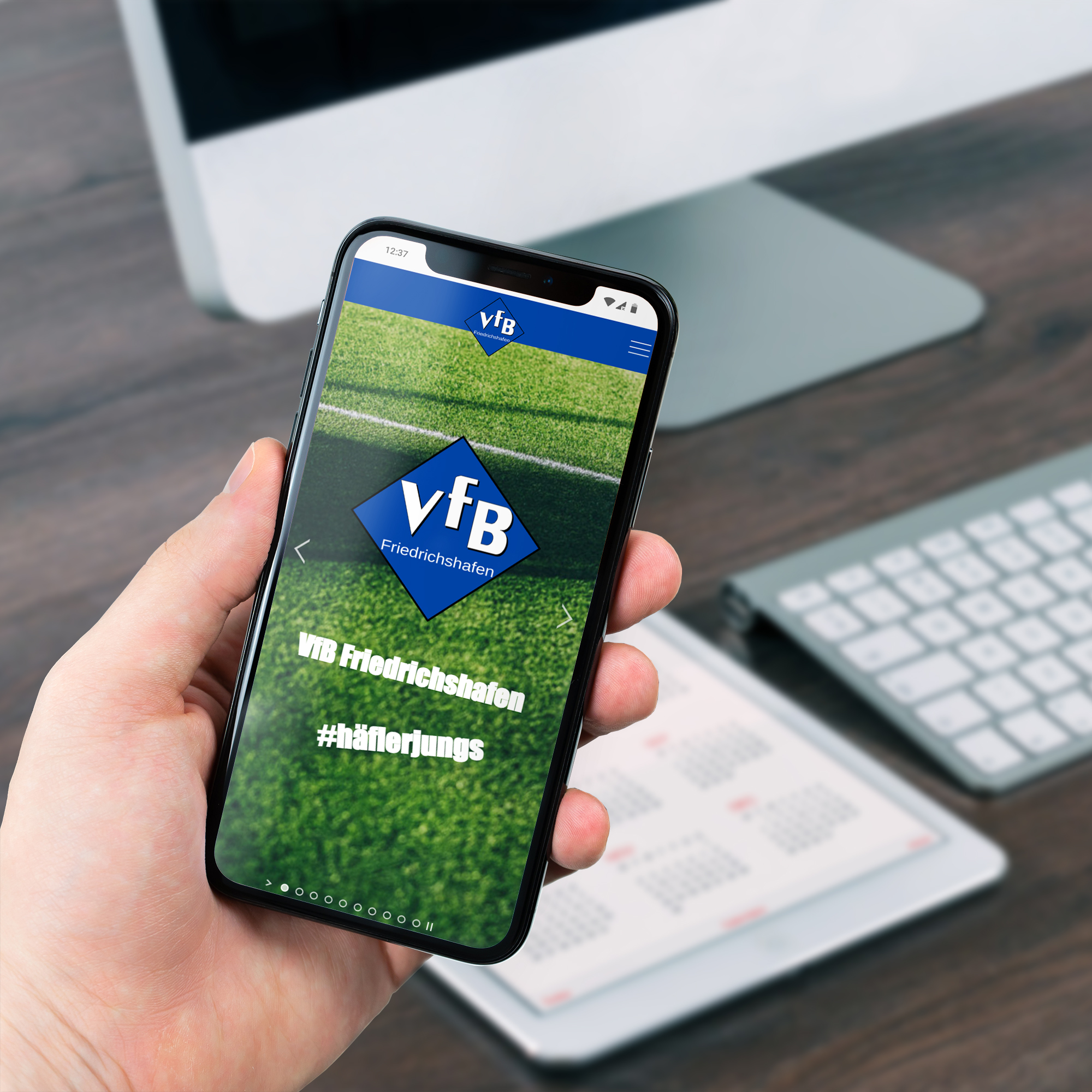 VfB Website Holding Phone Mockup